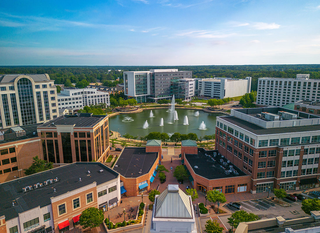 Contact - Aerial View of Newport News, Virginia With a Large Fountain on a Sunny Day