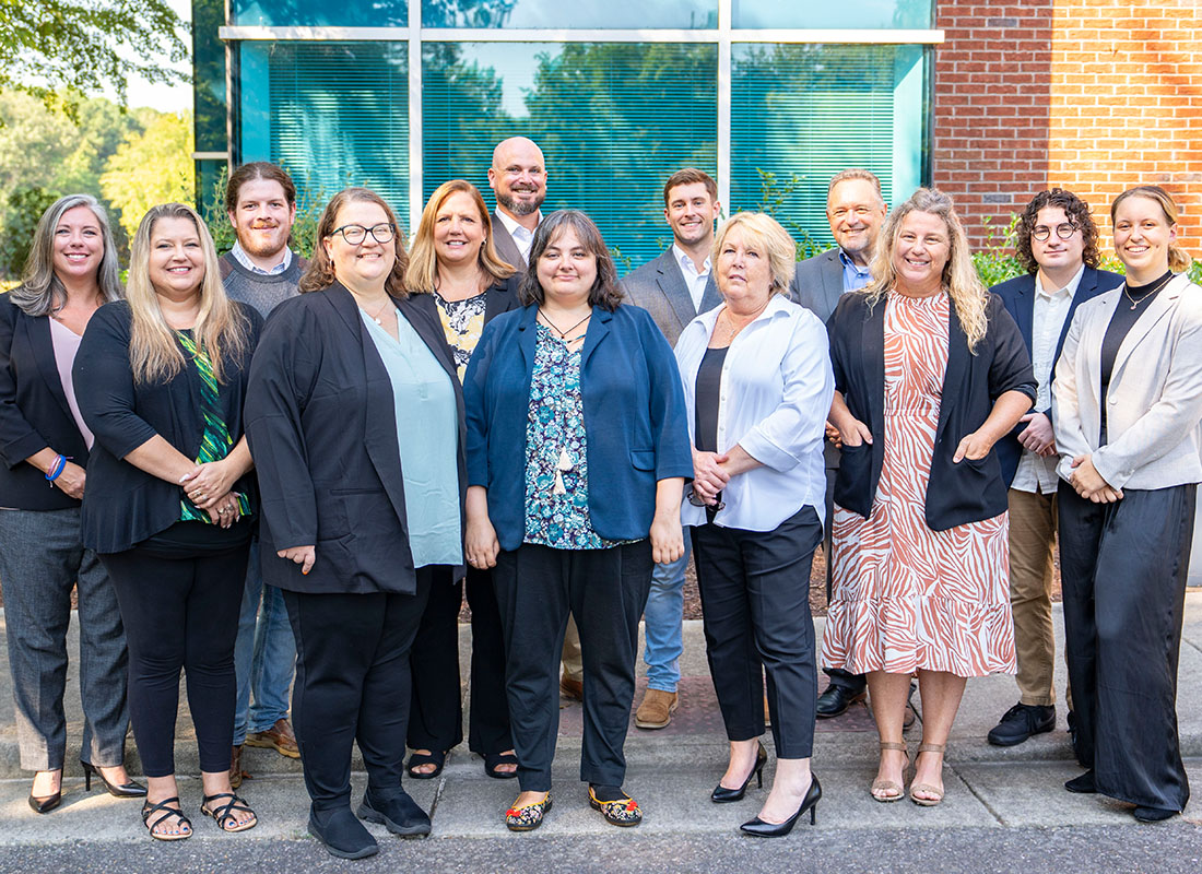 About Our Agency - Goodrich & Watson Insurers, Inc Team Standing Together